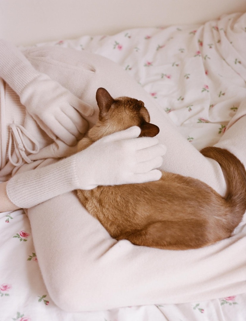 Inez wears Baby Cashmere Knit Pants in Top Light Pink, and Baby Cashmere Knit Long Gloves in Top Light Pink