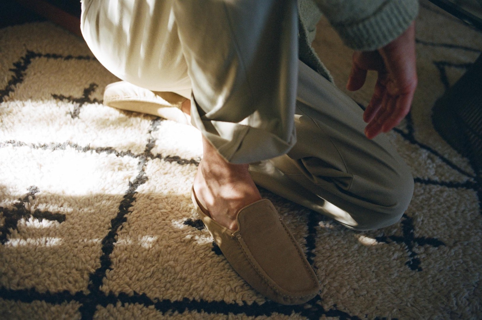 Rel wears Cotton Linen Cut Shaggy Knit Cardigan in Light Green, Hard Twist Finx Heavy Chino Slacks in Khaki, Suede Moccasin Slippers in Beige