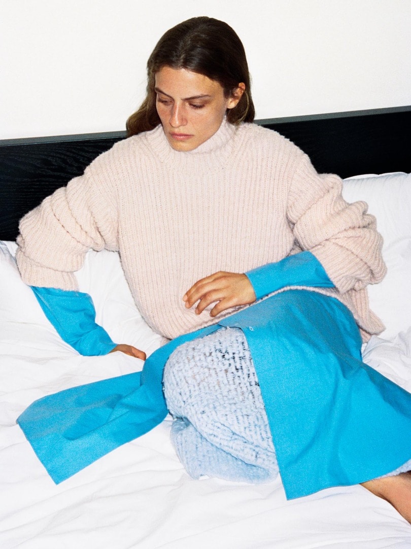Marie wears Wool Baby Camel Brushed Yarn Knit Turtle in Light Pink, Washed Finx Twill One-Piece in Blue and Milled Wool Mole Knit Skirt in Light Blue