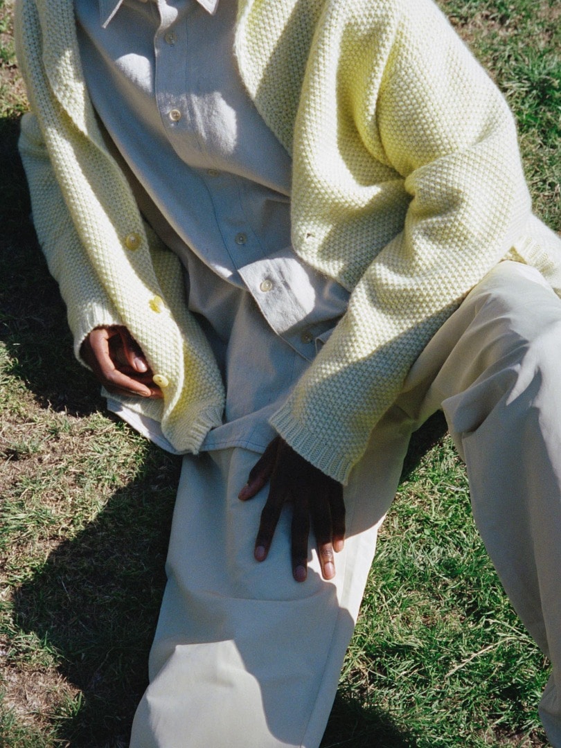 Baba wears Baby Cashmere Knit Shawl Collor Big Cardigan in Top Light Yellow, Botanical Dyed Selvedge Denim Shirts Blouson and Botanical Dyed Selvedge Denim Pants in Natural Green