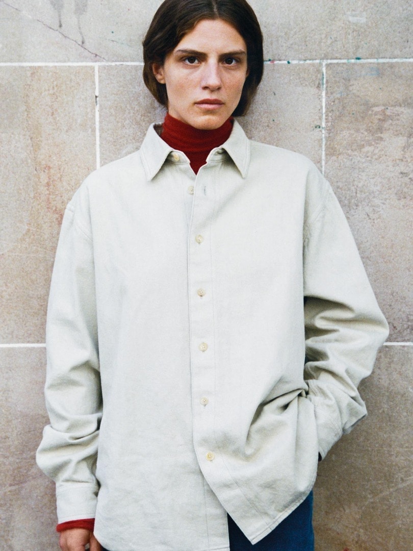 Marie wears Botanical Dyed Selvedge Denim Shirts Blouson in Natural Green, Kid Mohair Sheer Knit Turtle in Red, Selvedge Light Denim Pants in Light Indigo