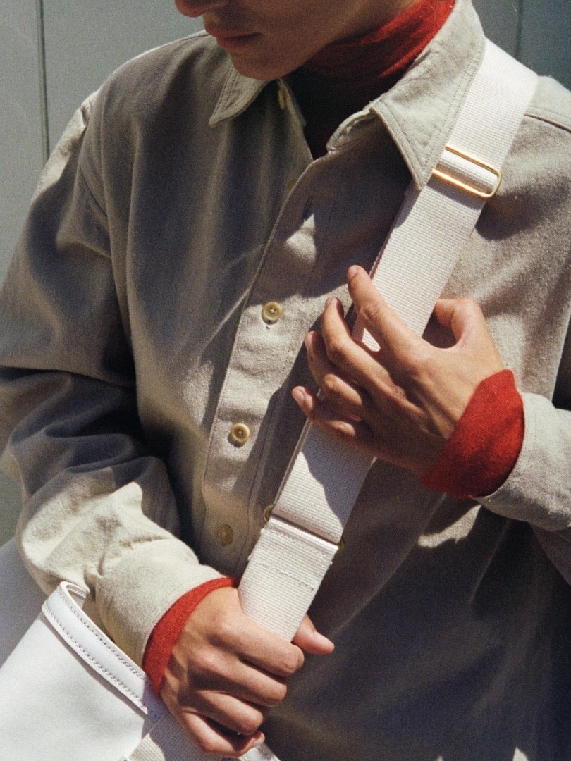 Marie wears Botanical Dyed Selvedge Denim Shirts Blouson in Natural Green, Kid Mohair Sheer Knit Turtle in Red, Selvedge Light Denim Pants in Light Indigo and 