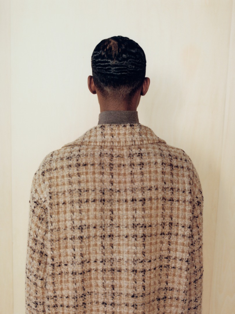 Mohamed wears Homespun Tweed Shirts Blouson in Beige Tweed