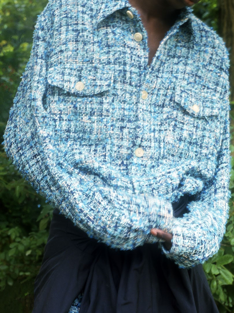 Sidy wears Homespun Summer Tweed Shirts Blouson in Light Blue×Navy