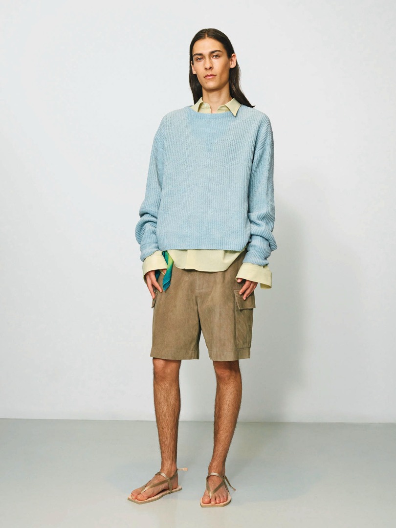 Bruno wears Hard Twist Wool Rib Knit Boat Neck P/O in Light Blue, Goat Suede Shorts in Khaki Beige