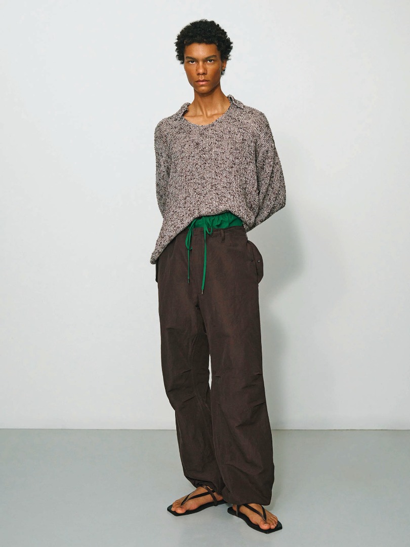 Bodien wears Cotton Slub Mix Top Yarn Rib Knit Skipper Polo in Top Brown, High Density Finx Linen Weather Easy Shorts in Green, High Density Finx Linen Weather Field Pants in Dark Brown