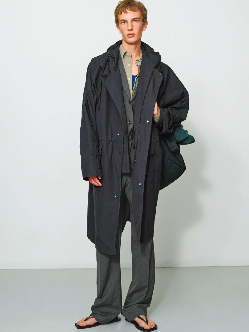 Maurits wears High Density Cotton Polyester Cloth Hooded Coat in Black, Super Fine Tropical Wool Slacks in Top Charcoal